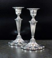 Lot 112 - A pair of Edwardian silver candlesticks,...