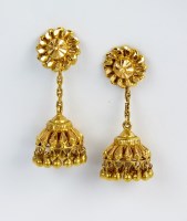 Lot 147 - A pair of yellow metal stylised tassel ear...