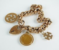 Lot 153 - A yellow metal curb link bracelet, with...