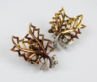 Lot 169 - A pair of diamond set stylised leaf clip...