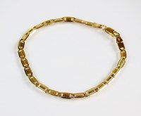 Lot 195 - A yellow metal pierced bar link bracelet, the...