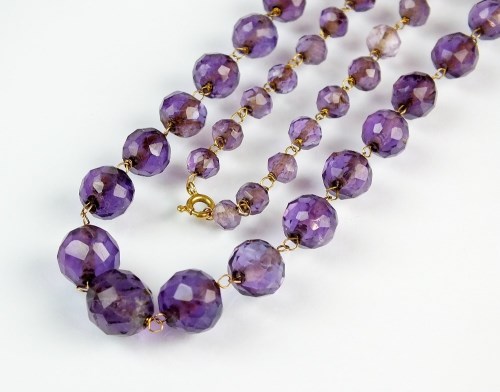 Lot 198 - A graduated amethyst bead necklace, comprising...