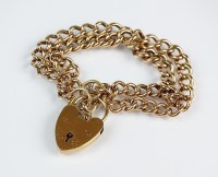 Lot 203 - A 9ct gold double curb link bracelet, with...