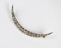 Lot 244 - A Victorian diamond crescent brooch,...