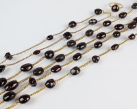 Lot 252 - A 19th century garnet set guard chain, the...