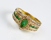 Lot 271 - An emerald and diamond dress ring, designed as...