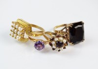 Lot 273 - A 9ct gold smoky quartz dress ring, together...
