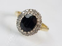 Lot 278 - An 18ct gold sapphire and diamond oval cluster...