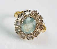 Lot 282 - An aquamarine and diamond oval cluster ring,...