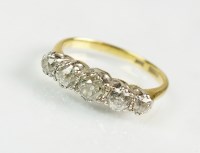 Lot 283 - A five stone graduated diamond ring, the five...