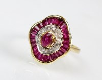 Lot 285 - An 18ct gold ruby and diamond dress ring,...