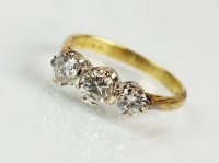 Lot 296 - An 18ct gold three stone graduated diamond...