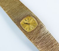 Lot 330 - A lady's 9ct gold Tissot Stylist bracelet...
