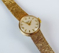 Lot 335 - A lady's 9ct gold Longines bracelet watch, the...