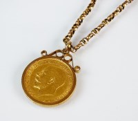 Lot 365 - A George V sovereign, dated 1911, within 9ct...