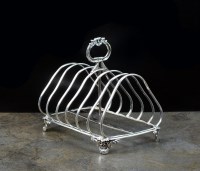 Lot 25 - A Victorian silver six division toast rack,...