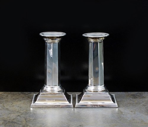 Lot 36 - A pair of Edwardian short silver candlesticks,...