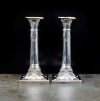 Lot 37 - A pair of Edwardian silver candlesticks,...