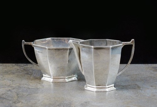 Lot 42 - An Art Deco silver sugar bowl and cream jug,...