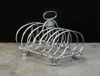 Lot 69 - A George IV silver six division toast rack,...