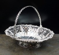 Lot 122 - A George III silver swing handled basket, RM,...