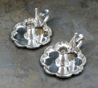 Lot 124 - A pair of Victorian silver chambersticks,...