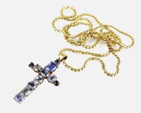 Lot 150 - A graduated sapphire set cross pendant,...