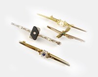 Lot 154 - An Art Deco onyx, seed pearl and diamond bar...