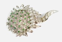 Lot 161 - A diamond and emerald stylised sunflower bar...