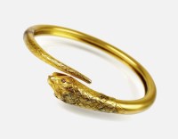 Lot 167 - A late 19th century stylised snake bangle, the...