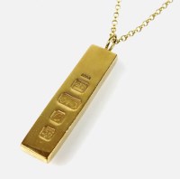 Lot 187 - A 9ct gold ingot pendant, with attached yellow...