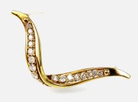 Lot 190 - An 18ct gold diamond set brooch, designed as...