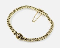 Lot 211 - A yellow metal curb link chain, with central...