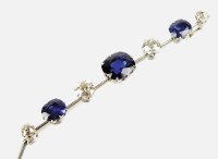 Lot 224 - A sapphire and diamond bar brooch, designed as...