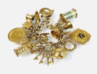 Lot 236 - A 9ct gold textured link charm bracelet with...