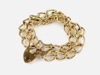 Lot 242 - An 18ct gold double curb link bracelet, with...