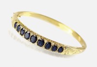 Lot 248 - An 18ct gold sapphire and diamond hinged...