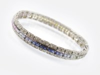 Lot 252 - A multicoloured sapphire and diamond line...