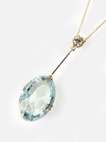 Lot 257 - An aquamarine and diamond pendant, the oval...