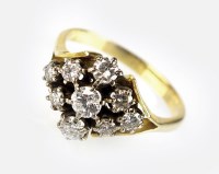 Lot 271 - A nine stone diamond cluster ring, designed as...