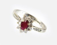 Lot 274 - An 18ct white gold ruby and diamond cluster...