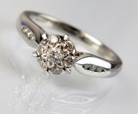 Lot 284 - An 18ct white gold diamond floral cluster ring,...