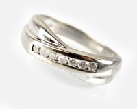 Lot 285 - An 18ct white gold diamond set band, designed...