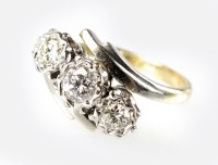 Lot 288 - A three stone diamond ring, designed as three...