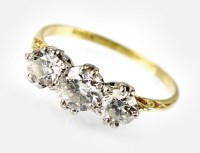 Lot 302 - A graduated three stone diamond ring, designed...