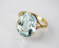 Lot 304 - A single stone aquamarine dress ring, the oval...