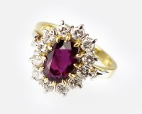 Lot 305 - An 18ct gold ruby and diamond cluster ring,...