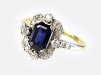 Lot 321 - A sapphire and diamond cluster ring, designed...