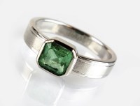 Lot 328 - A single stone emerald dress ring, the square...