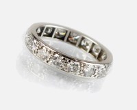 Lot 342 - A platinum and diamond full hoop eternity ring,...